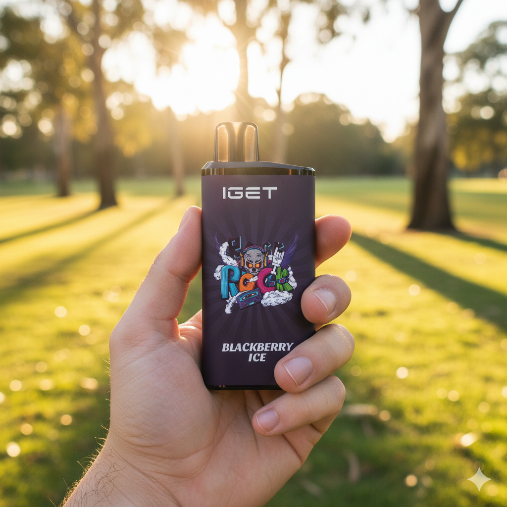 The IGET Bar Pro Blackberry Ice disposable vape held in hand against a blurred Australian outdoor background.
