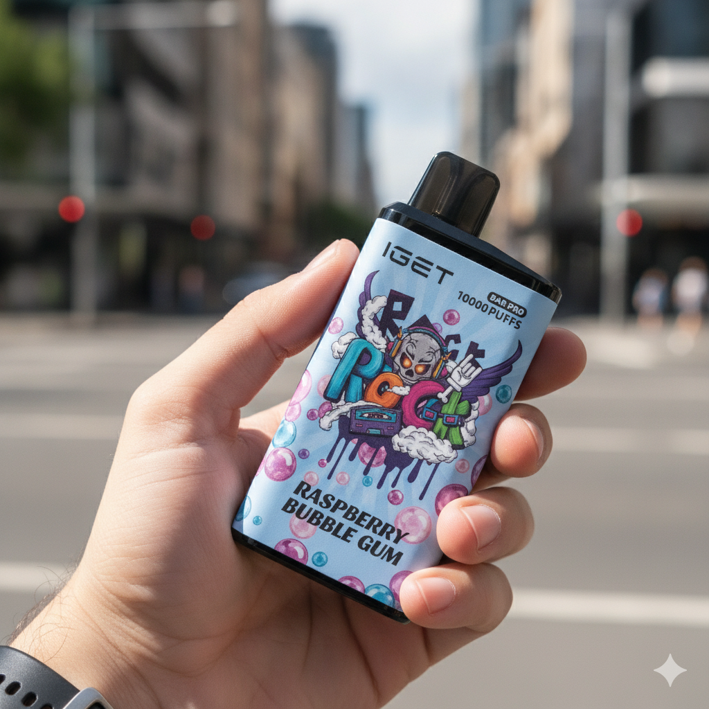 A hand holding the IGET Bar Pro Blueberry Raspberry Bubble Gum vape, with the colourful graffiti-style body in sharp focus.